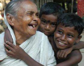 A grandmother laughs with her two grandsons in Howrah, India. © 2012 Susanta, Courtesy of Photoshare